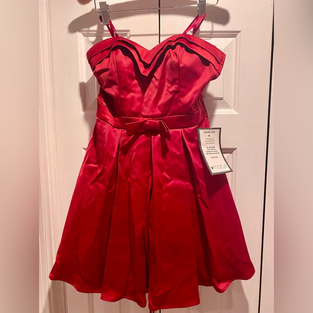 Brand new never worn prom / occasion dress . Red. Size 7 juniors. From Macy’s